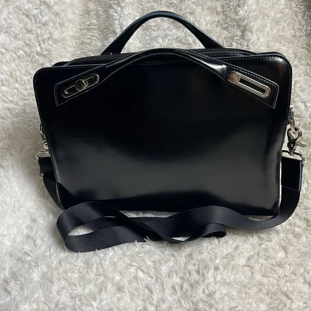 Abbi New York Laptop/Briefcase Carrier Black leather inside padded fabric.